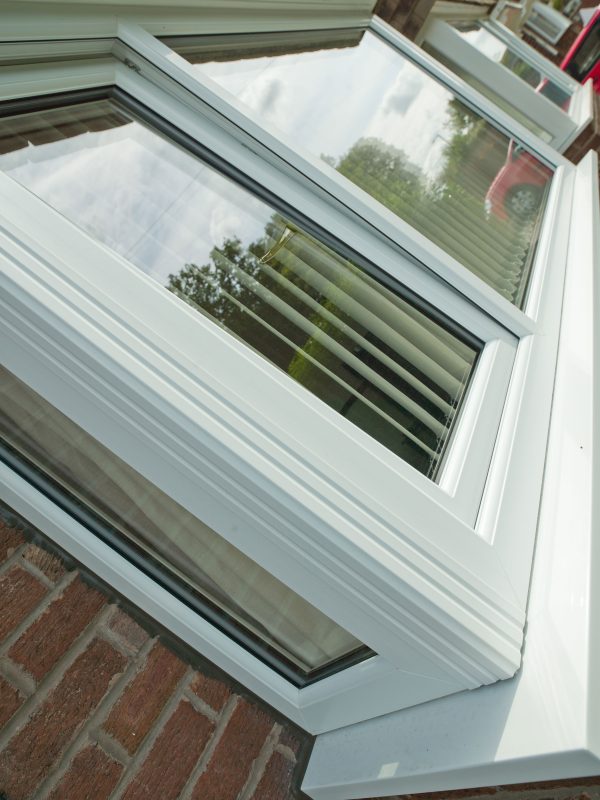 Liniar tilt and turn bay window in white