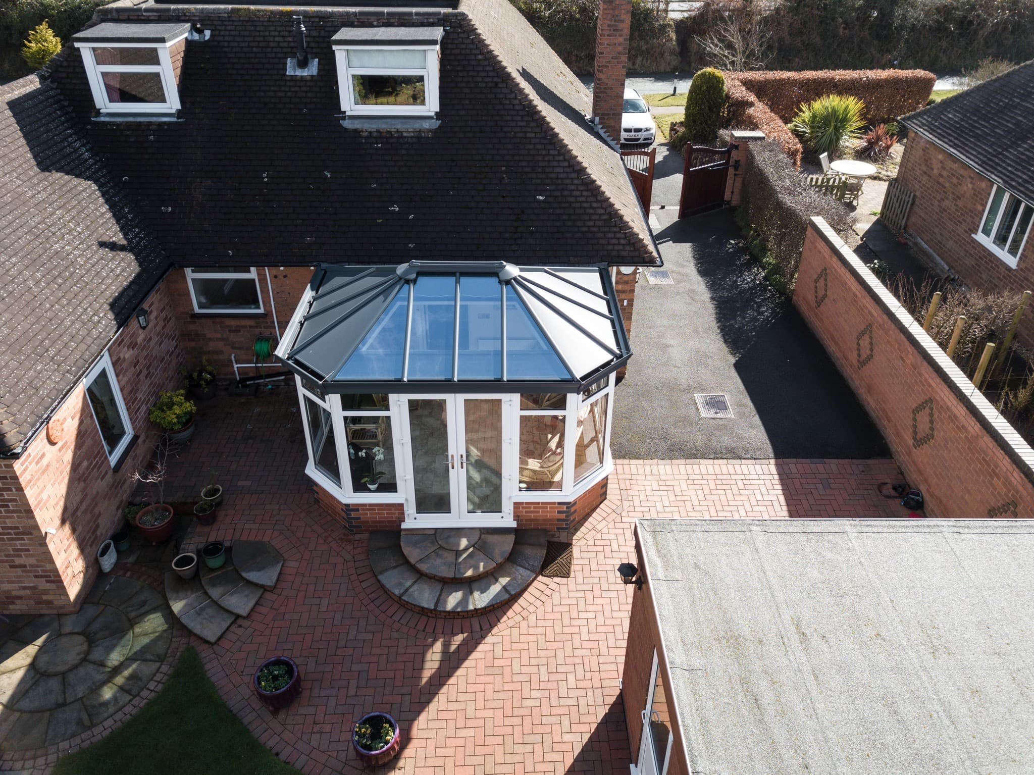 An aerial photo of a glass roof extension.