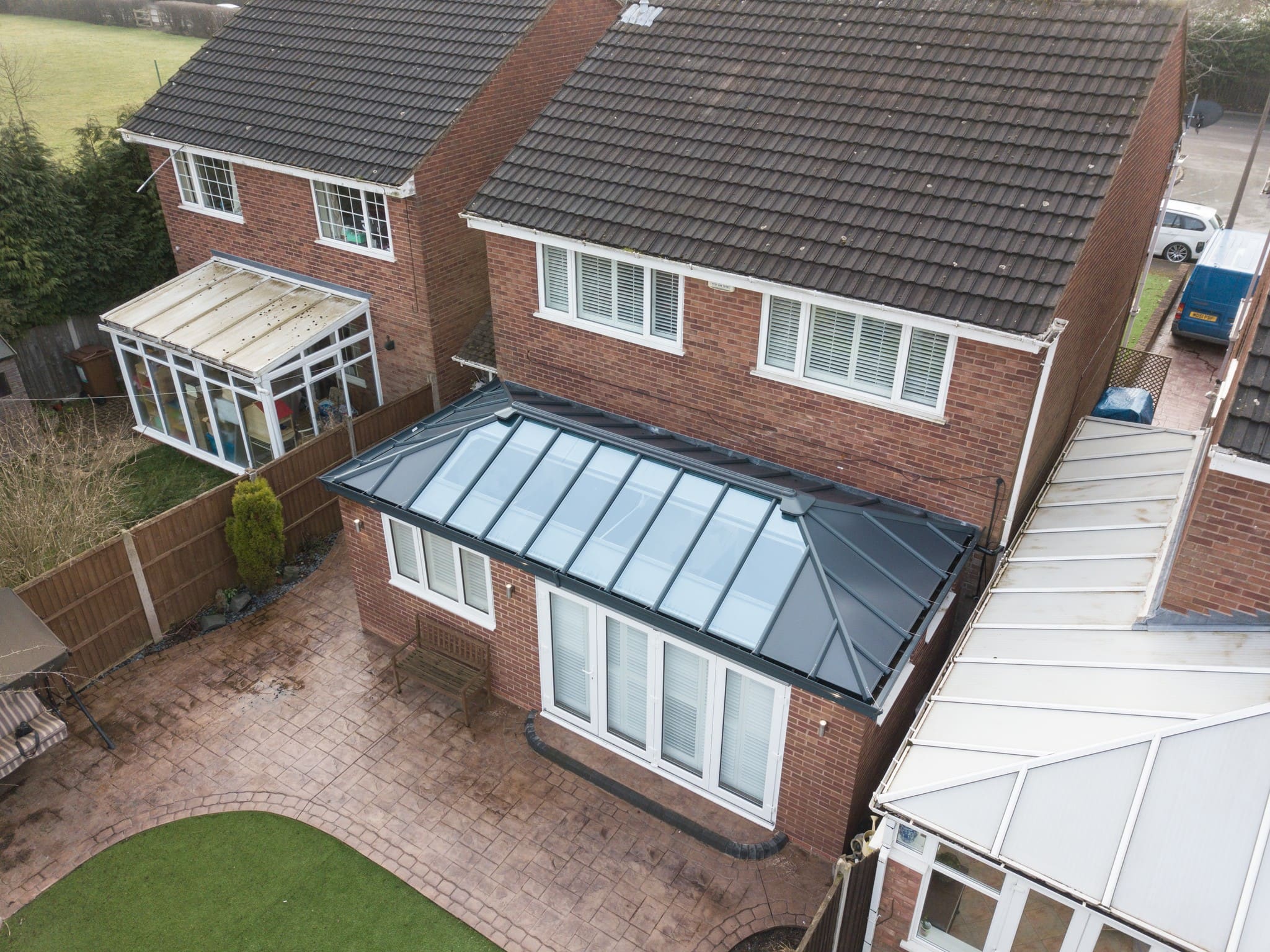 An aerial photo of a single storey extension with a garden and patio.