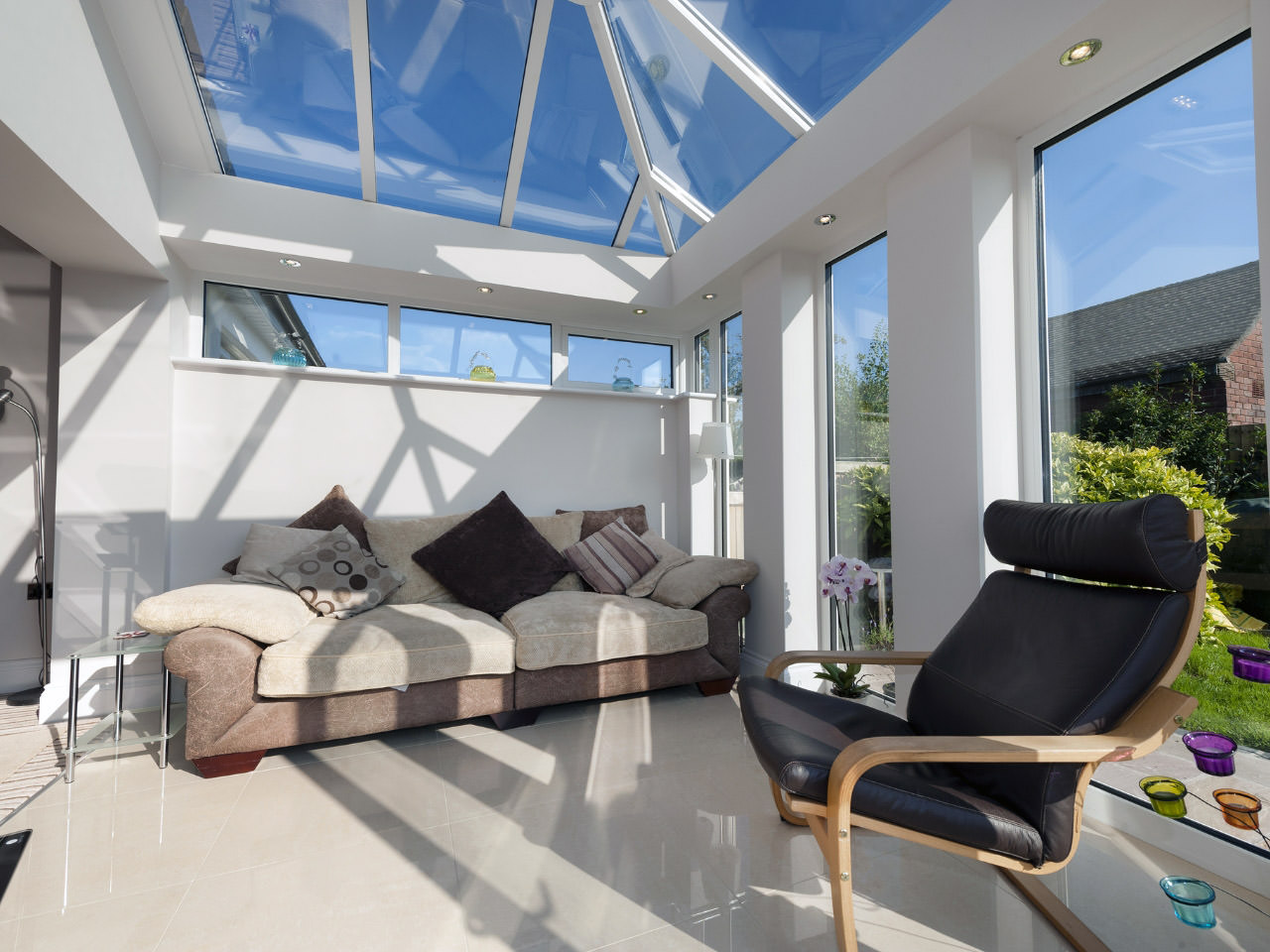 A glass conservatory roof on a sunny day.