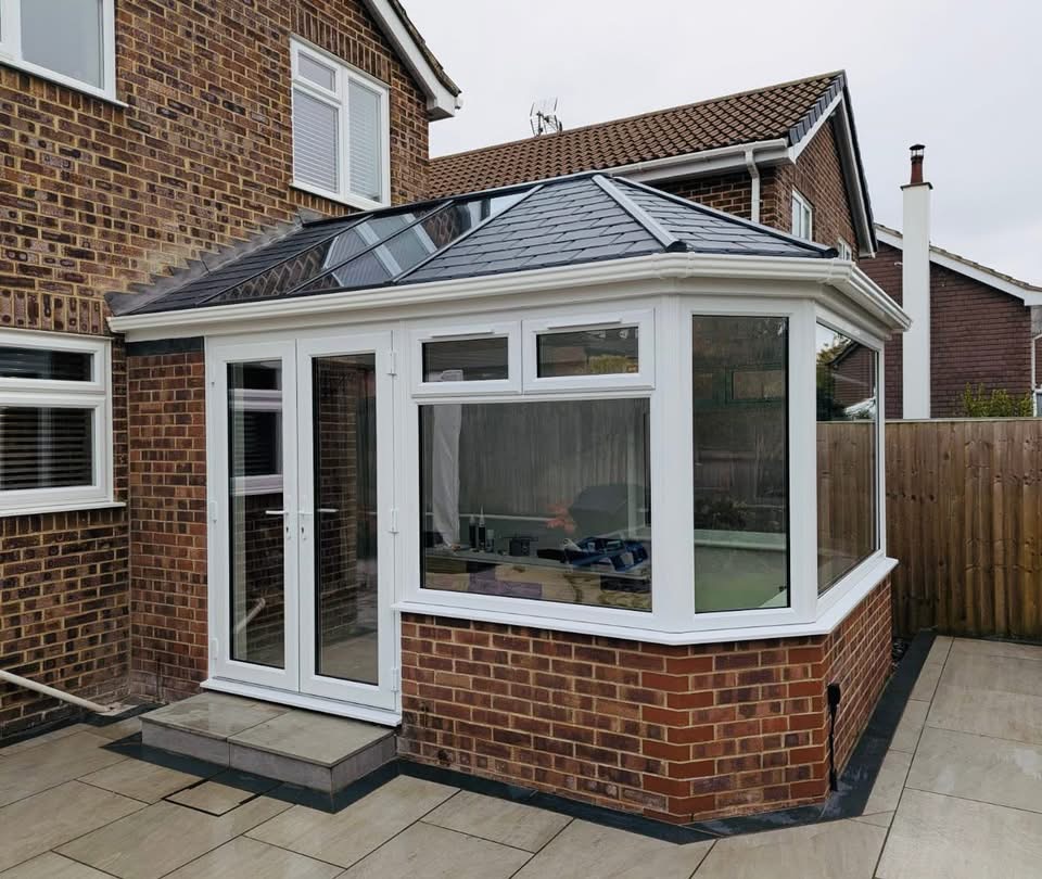 Modern anthracite grey refurbished conservatory with tiled roof