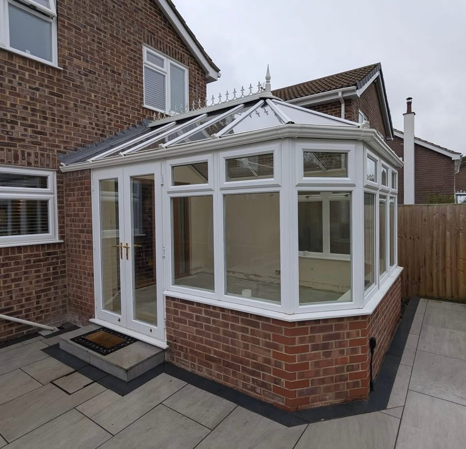Old dated white conservatory before refurbishment