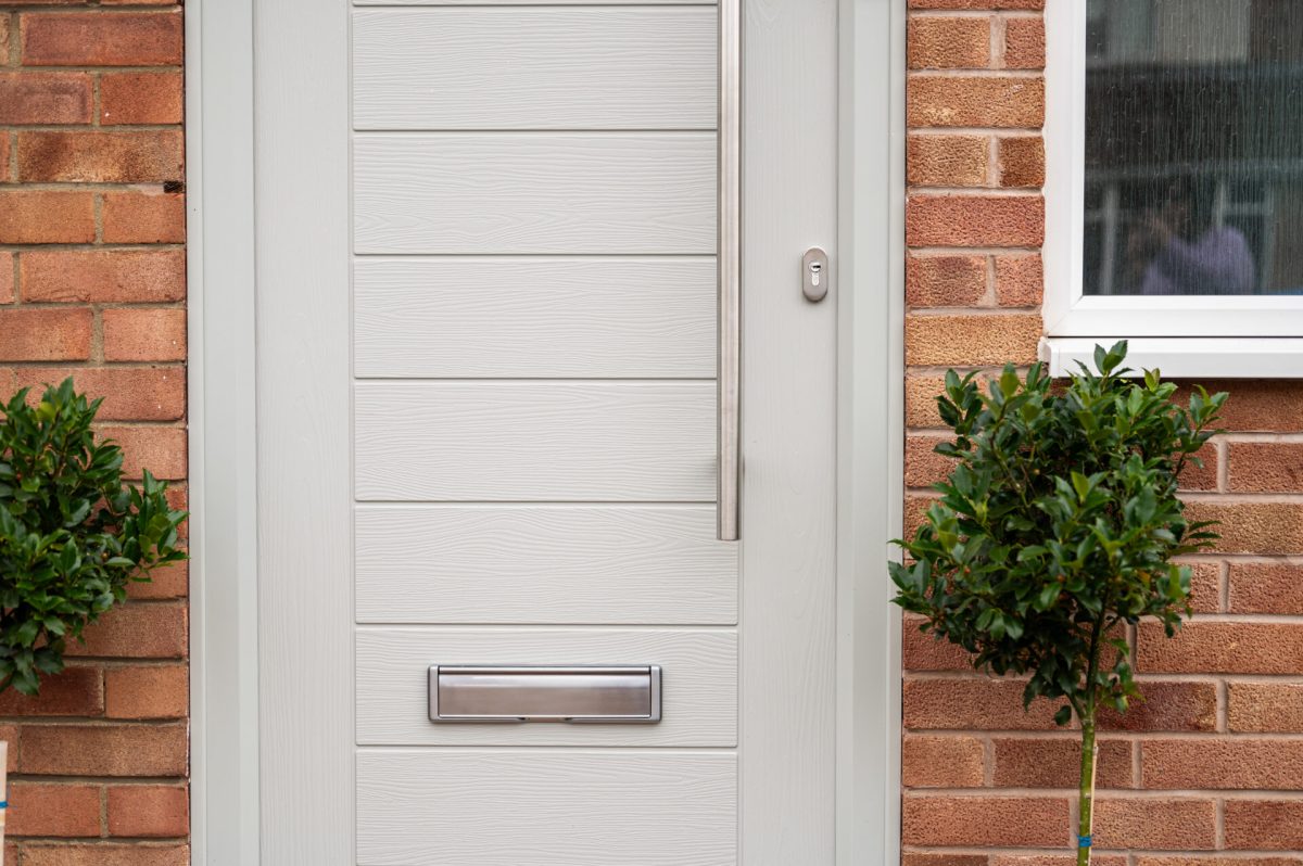 Composite door with bar handle