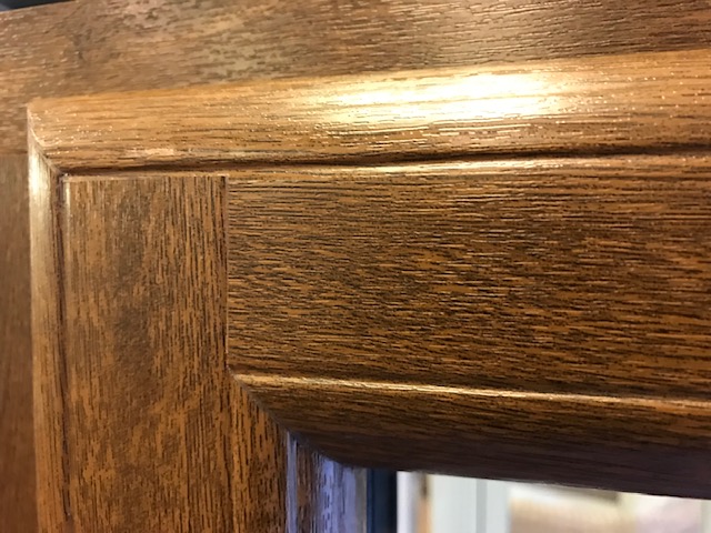Close up of mechanically jointed uPVC window corner mimicking timber butt joint