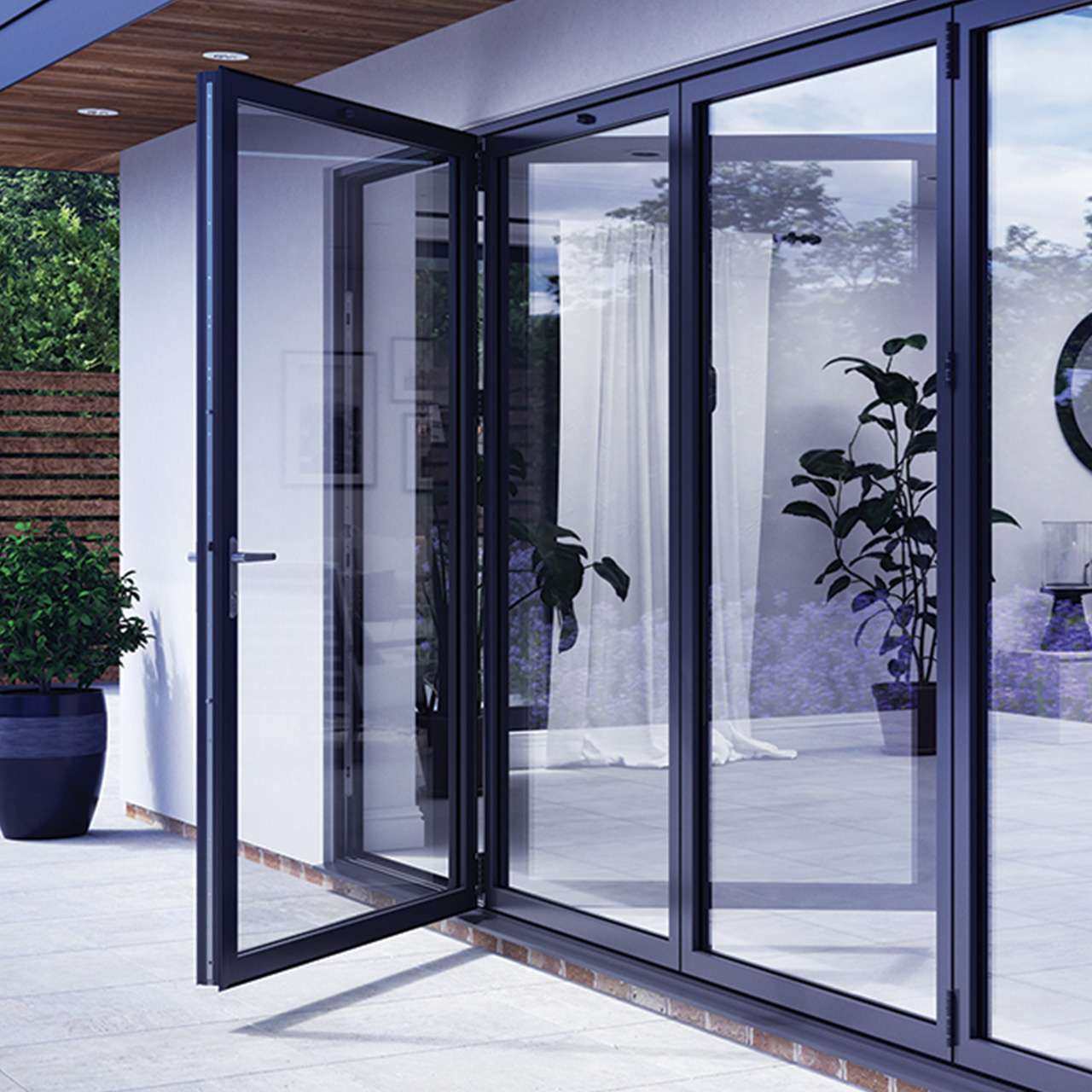 Korniche aluminium bi-fold doors creating a wide opening to a garden
