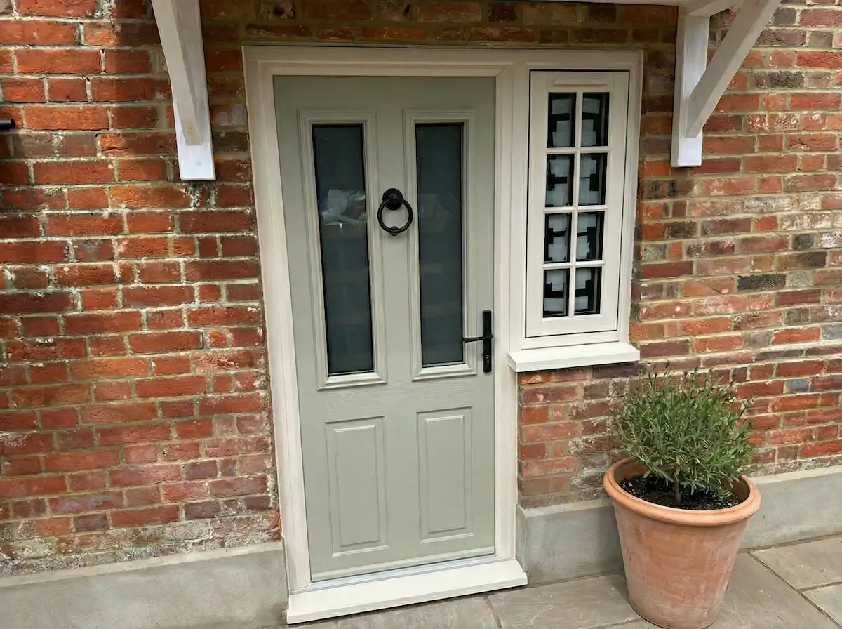 Composite door installed next to a Residence 9 flush sash window