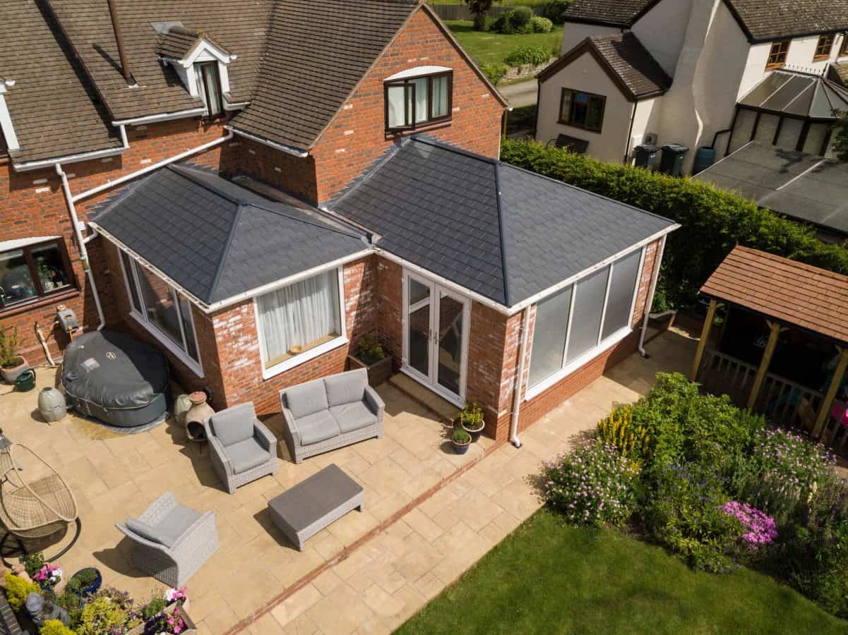 External view of a tiled conservatory roof extension matching the house tiles