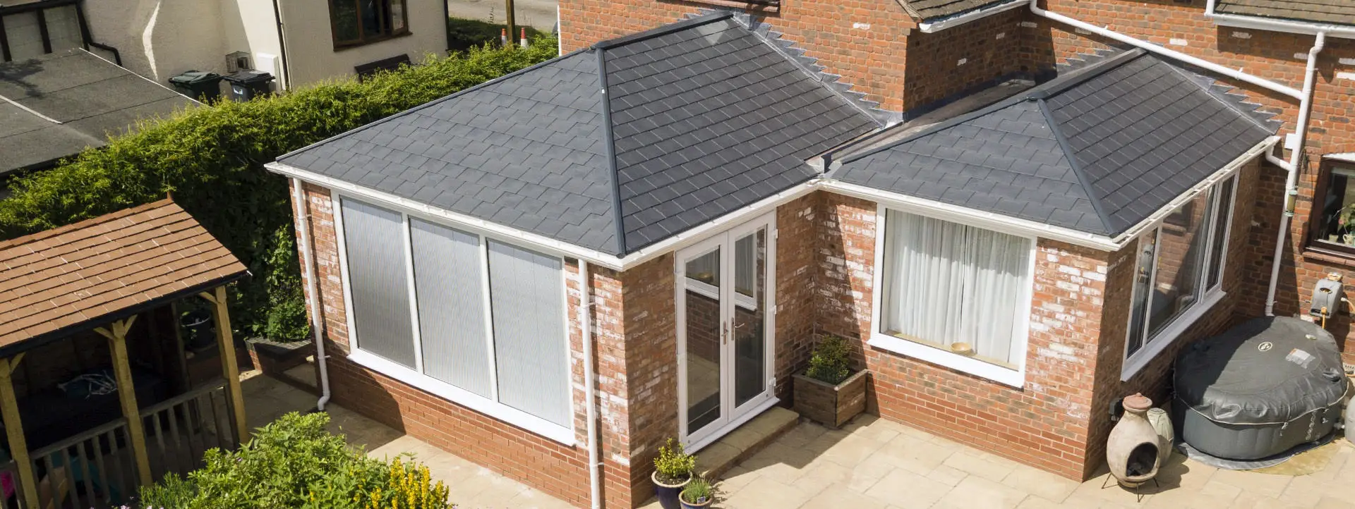 A premium Ultraroof solid tiled conservatory replacement roof providing a year round living space