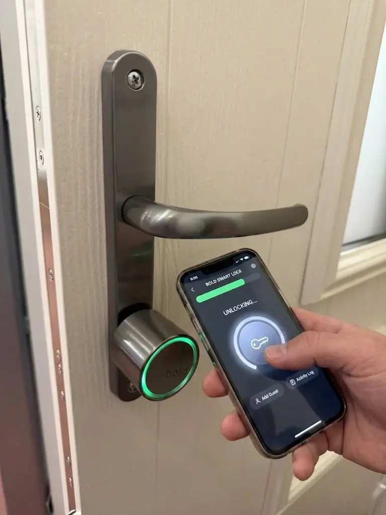 Homeowner operating a smart door lock from their mobile phone