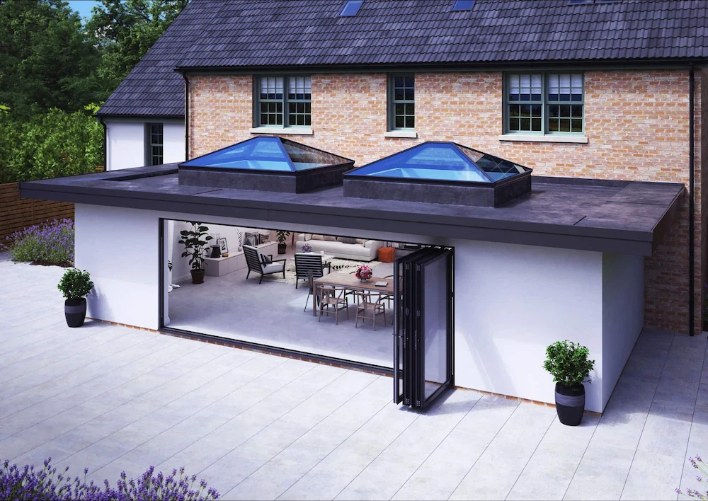 A stunning modern home extension featuring a large architectural roof lantern and wide bi-fold doors