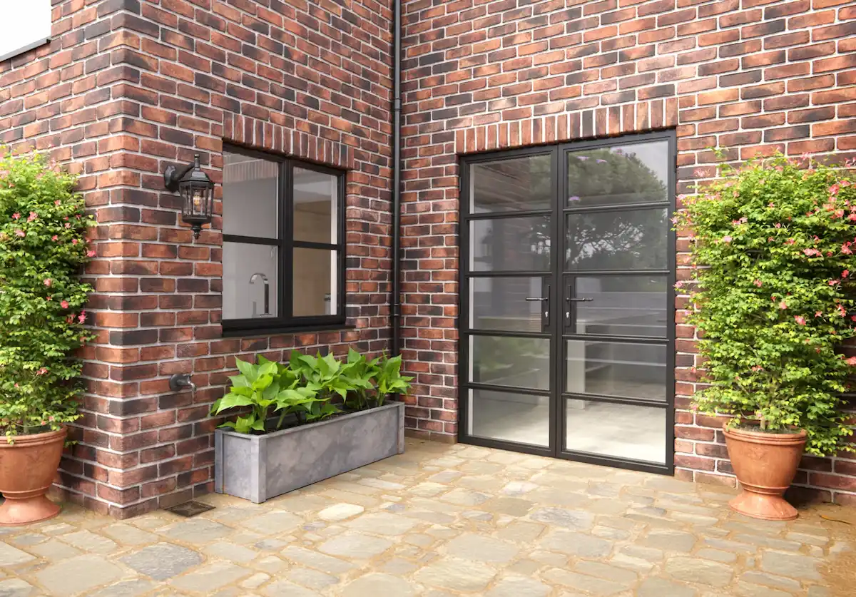 Sheerline Heritage French doors and matching windows opening to a patio