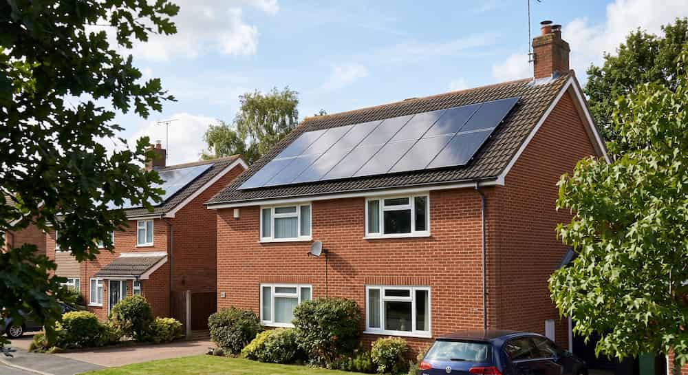 Modern solar PV panels installed on a residential roof, offering energy independence from grid price hikes