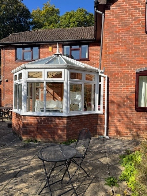 The old, outdated Victorian polycarbonate conservatory before the transformation