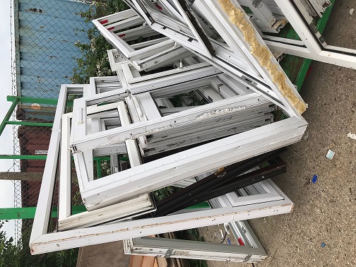 Old PVCu windows ready for recycling