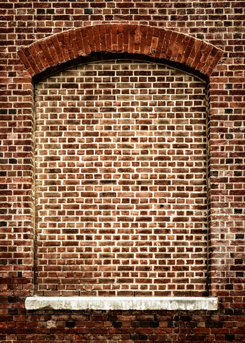 Daylight robbery. A bricked up window with an arched head