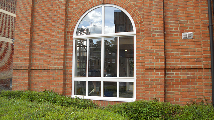 Arched Hardwood Window Hardwood arched window in white