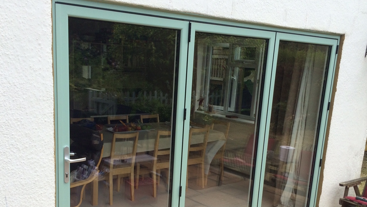 Bi-folding-door-in-cotswold-green.jpg Bi-folding doors in cotswold green