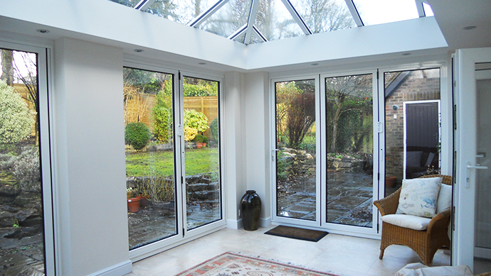 Bi-folding-doors-in-conservatory.jpg Two bi-folding doors in a conservatory